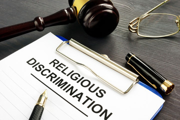 gavel and clipboard that says religious discrimination