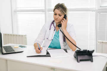 doctor writing note