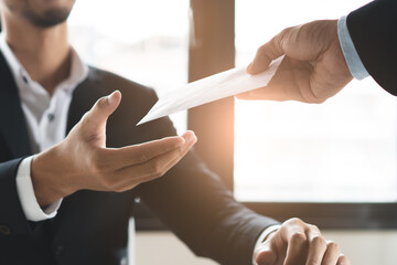 employer handing employee pay check