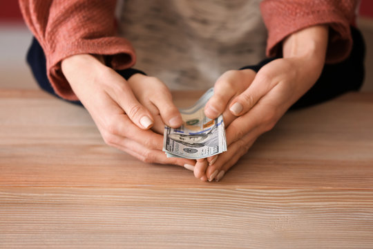 child hands with parents hands and money