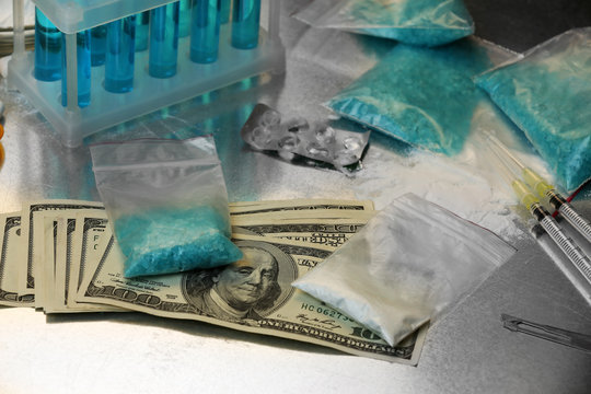 illegal drugs on table with money