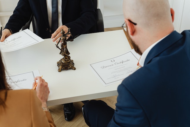 couple with divorce certificates