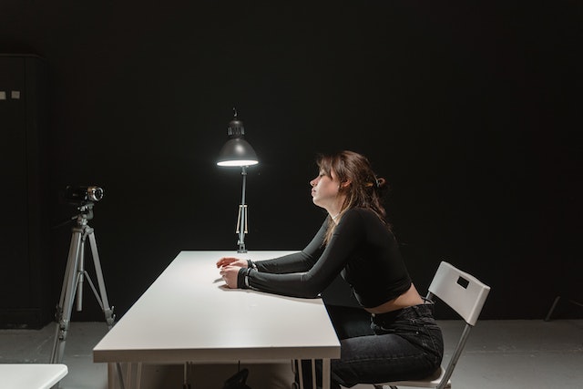 woman at poorly lit table